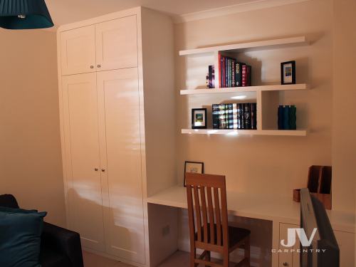 Built in wardrobe, home office desk and smart floating shelves above the desk 